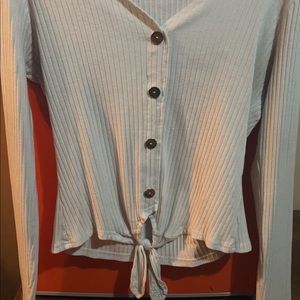This is a white kind of half top buttoned down in a size XL